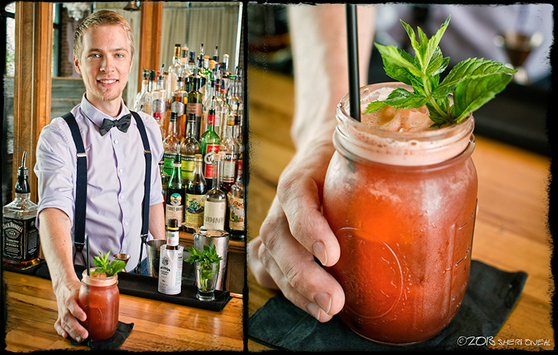 Holland House Restaurant bartender with blody mary drink in mason jar