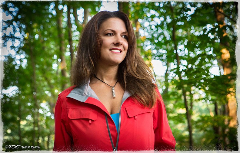 Payge McMahon in red raincoat