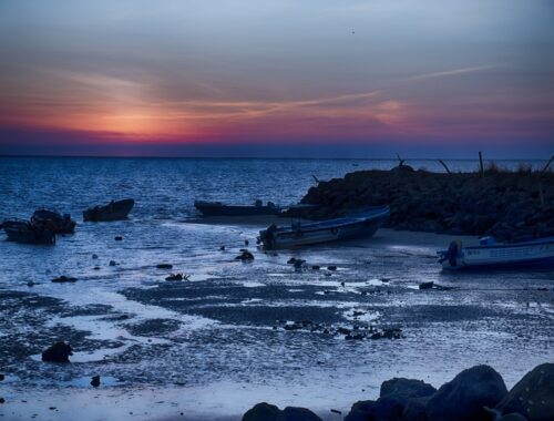 Canoa, Ecuador sunset boats