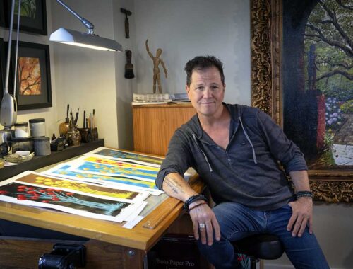 Terrell Thornhill at drafting table in his art studio