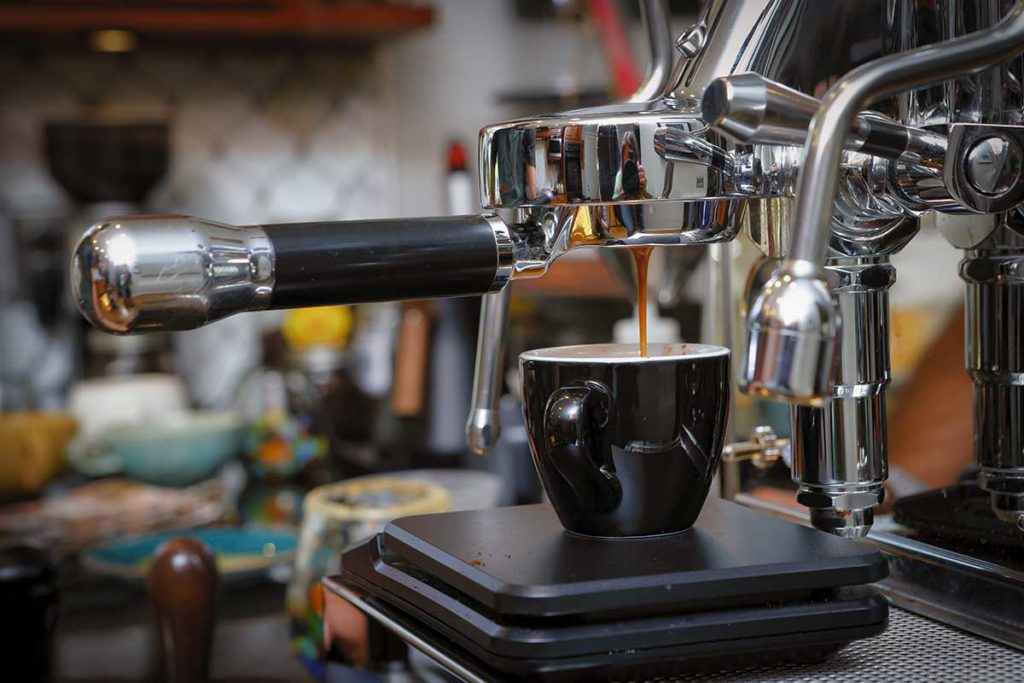 expresso machine making a cup of expresso