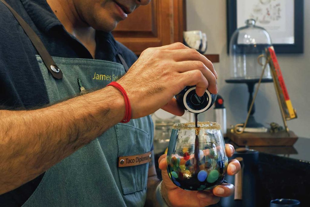 pouring expresso coffee to a glass