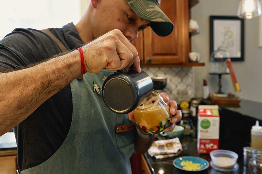 pouring late froth into a glass