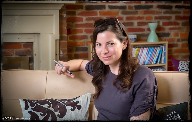 Kate O'Neill, speaker, author, mentor and consultant on the tan couch in her Nashville home for the photo blog series Fabulous Women Over 40