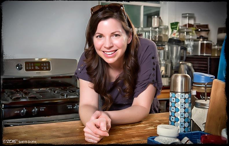 Kate O'Neil in her Nashville kitchen leaning on the wooden countertop for the photo blog series Fabulous Women Over 40