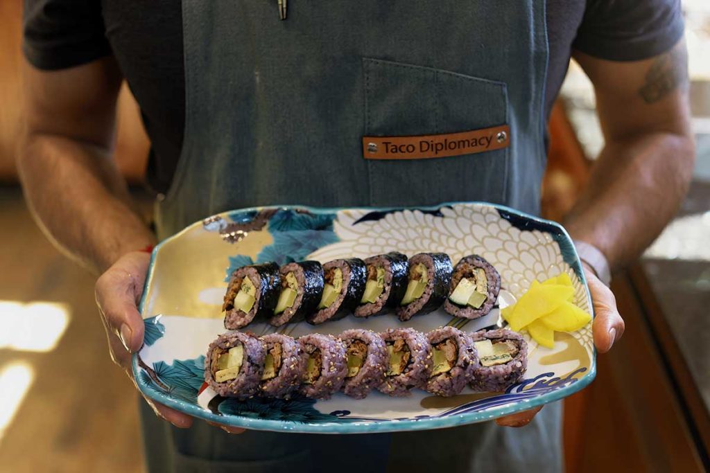 a plate of seaweed rolls